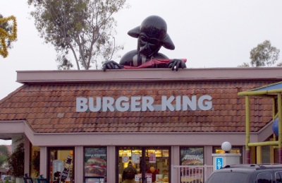 Darth's Burgers Half-inflated Darth Vader atop a Burger King restaurant